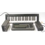 Yamaha CX5M musical computer, boxed; together with a Yamaha YK-10 music keyboard, boxed and a Yamaha