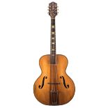 1940s Harmony Patrician archtop guitar, neck heavily bowed, refinished, soft bag; together with an