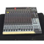 Behringer Xenyx 2442FX mixing desk, within a Gator case (channel five at fault)