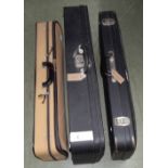 Two oblong plush lined double violin cases; also an oblong single violin case with outer zipper