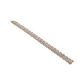 9ct diamond line bracelet, set with twenty-four diamond encrusted S-shaped links, 29.4gm, 8" long