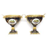 Large impressive pair of blue glaze porcelain and gilt metal mounted vases, with still fruit