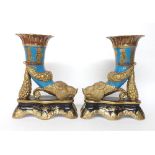 Pair of Sevrés style cornucopia porcelain vases raised upon shaped bases, on powder blue ground with