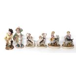 Three pairs of German style porcelain figural groups, two with children/putti and goats, the other