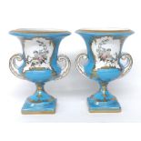 Pair of Sevrés style twin-handled campagna vases, with cherub panels on a powder blue ground with