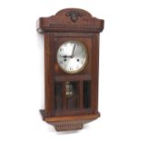 1930s oak wall clock, 21" high (pendulum and winding key)