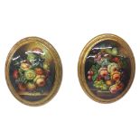 Pair of decorative oval convex wall plaques with floral still life, 13" high (2)