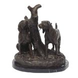 Contemporary bronze figural group of two dogs leashed to a tree, upon a naturalistic base raised