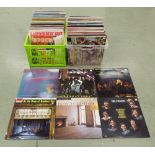 Two crates containing a collection of over one hundred and fifty vinyl record LPs relating to