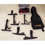 Six A-frame guitar stands including three by Hercules; together with a small selection of leather