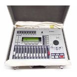Yamaha AW16G professional audio workstation, with power lead and manual within a flight case