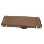 Fender G & G hard case with brown exterior and yellow interior