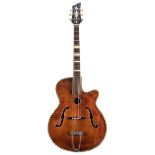 1950s German archtop guitar with various restorations, including a partially restored parting to the