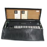 Korg M1 music workstation keyboard, made in Japan, ser. no. 300869, within a wooden case and with