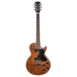 Les Paul Special style solid body electric guitar; Finish: walnut, various heavy marks, dings and