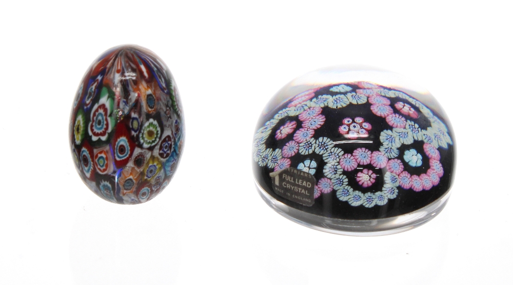 Whitefriars glass and millefiori floral chain paperweight, on a deep blue ground, 3" diameter;