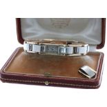 Cyma Watch Co. 1930s 18k bicolour gold lady's bracelet watch, the rectangular silvered dial with