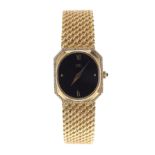 Ebel 18ct yellow gold and diamond octagonal cased lady's bracelet watch, black oval dial with