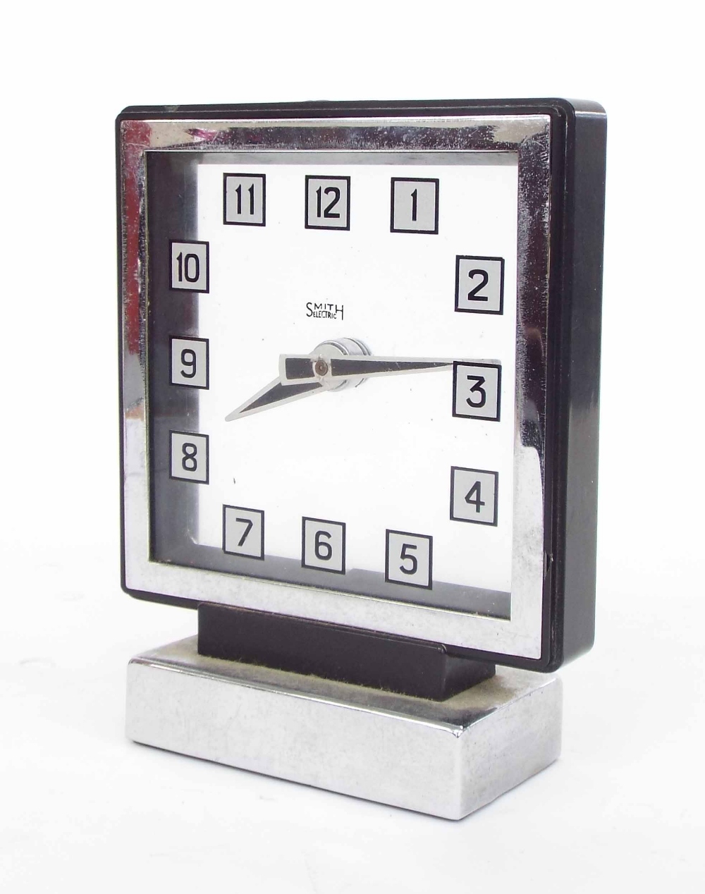 Smith electric Bakelite and chrome cased Art Deco mantel clock, the 5" square Perspex dial upon a