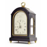Small George III ebonised alarm bracket timepiece, the 4" arched silvered dial signed Grimalde &