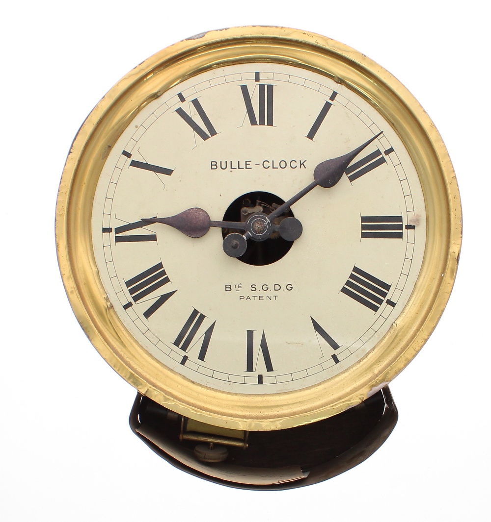 An unusual Bulle Clock in 11.5" diameter brass wall case, the painted skeletonised dial with exposed