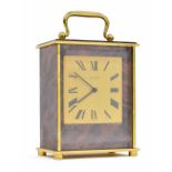 Jaeger-LeCoultre alarm clock, the 2.75" square brushed brass dial within a faux burr wood case