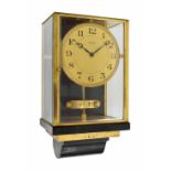 Unusual early Atmos wall clock, bearing a metal plaque verso inscribed Brevets J.L. Reutter S.G.D.