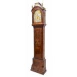 Fine walnut three train longcase clock with five pillar movement, the 12" brass arched dial signed