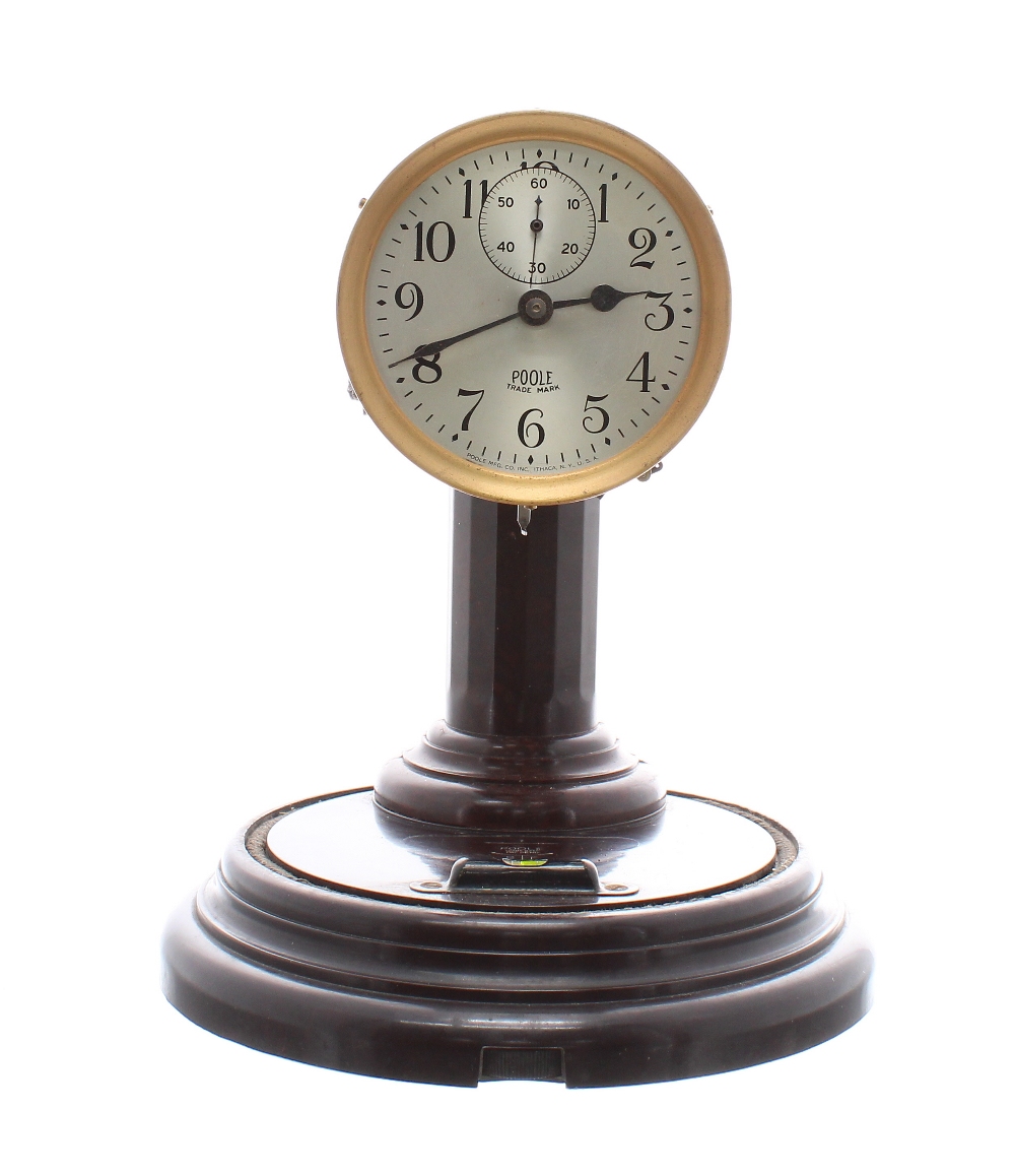 Early Poole Electric Clock Co. electric mantel clock, circa 1928, on round "Morsite" Bakelite base