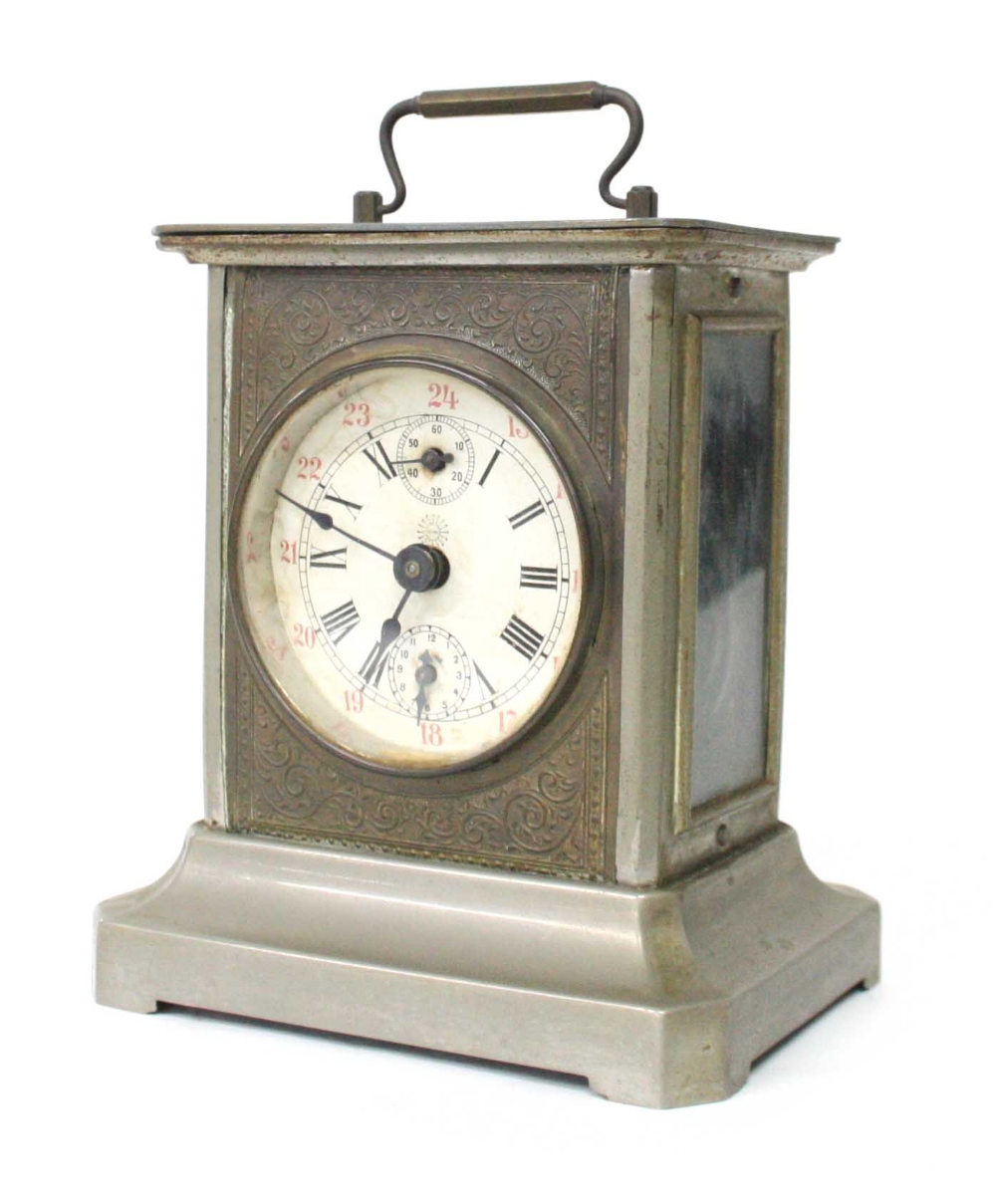 Musical carriage type clock, fitted with a cylinder and comb to the base, the 2.75" white dial