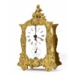 French brass mantel clock with alarm, the principal dial over an alarm dial and within an ornate