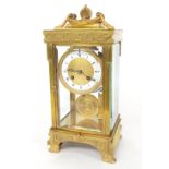 Good French fire gilded brass four glass two train mantel clock striking on a gong, the 3.5" white