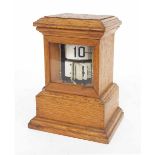 Rare slave and mechanical conversion electric ticket clock within a stepped oak glazed case, 6.75"