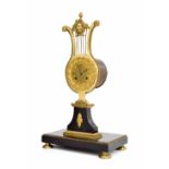 French ormolu and black marble two train lyre mantel clock, the movement with outside countwheel