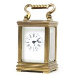Miniature brass carriage timepiece, with lever escapement and bimetallic compensated balance, within