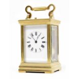 Good small repeater carriage clock striking on a gong, within a stepped corniche style brass case,