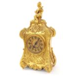 Gilt metal two train ornate mantel clock, the 4.25" dial within an ornate case with gilt metal