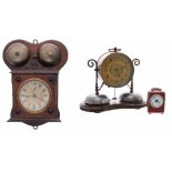 Three early 20th century clocks; Junghans "Nightingale" drum alarm clock in brass case, mounted on
