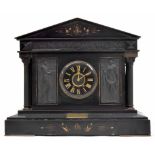 Large French black marble two train mantel clock striking on a gong, the 5.5" black dial within a