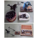 Four various hand tools and accessories, including a mainspring winder and hand lathe etc