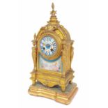French gilt metal and porcelain mounted two train mantel clock, the 3.25" painted dial over a