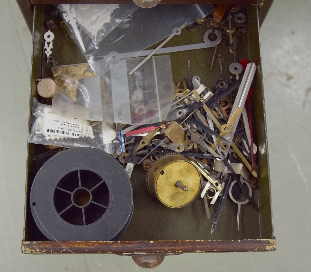 Clockmaker's metal upright chest of fifteen short drawers with contents including: clock parts, - Image 4 of 7