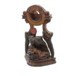 Interesting late 18th/early 19th century painted watch stand carved with a nude man grappling with a