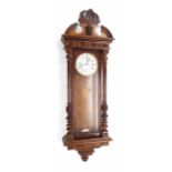 Walnut two weight Vienna regulator wall clock, the 7" white dial with subsidiary seconds dial,