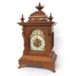 Junghans walnut three train bracket clock, the 6.25" brass arched dial with subsidiary chime/