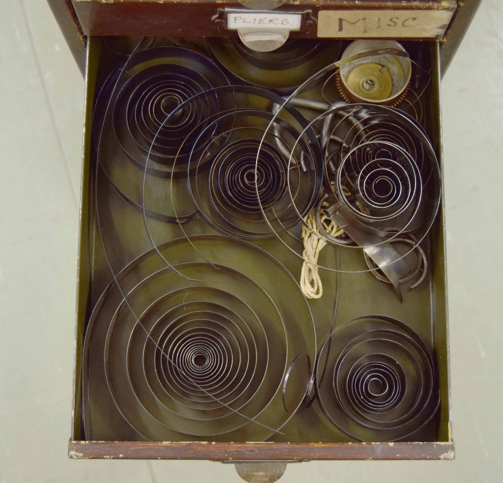 Clockmaker's metal upright chest of fifteen short drawers with contents including: clock parts, - Image 6 of 7