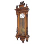 Walnut Vienna regulator two train wall clock, the 6.25" white dial with subsidiary seconds dial,