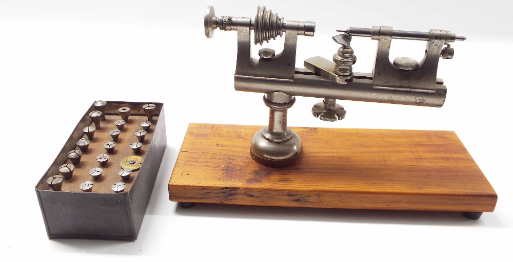 Early American 4mm watchmaker's lathe, upon a pine rectangular plinth, 10.75" long overall (with