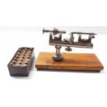 Early American 4mm watchmaker's lathe, upon a pine rectangular plinth, 10.75" long overall (with
