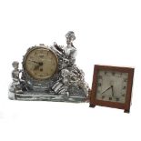 Smiths eight day silvered figural mantel clock, the 4.5" cream dial within a drumhead casing